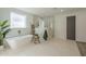 Elegant bathroom with a freestanding tub, spacious glass shower, and stylish fixtures at 2902 E Pierson St, Phoenix, AZ 85016