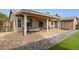 Covered back patio with tile flooring and outdoor furniture, great for entertaining at 3023 E John Cabot Dr, Phoenix, AZ 85032