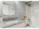 Bathroom featuring a granite countertop, silver hardware, and a shower/tub combination at 3023 E John Cabot Dr, Phoenix, AZ 85032