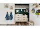 Closet with a changing table, storage baskets, and decorative art at 3023 E John Cabot Dr, Phoenix, AZ 85032