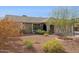 Landscaped front yard featuring desert plants and a charming facade with neutral colored stucco at 3023 E John Cabot Dr, Phoenix, AZ 85032