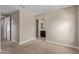 This bedroom features neutral walls and carpet, and has access to an ensuite bath at 3025 W Night Owl Ln, Phoenix, AZ 85085