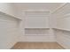 This is a walk-in closet with an abundance of shelving and closet rods at 3025 W Night Owl Ln, Phoenix, AZ 85085