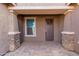 Inviting front porch with stone accents and a covered entryway at 3025 W Night Owl Ln, Phoenix, AZ 85085