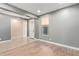 Inviting living room with neutral gray paint and wood-look floors at 3025 W Night Owl Ln, Phoenix, AZ 85085