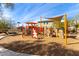 Colorful playground with climbing structures and shade covering at 3025 W Night Owl Ln, Phoenix, AZ 85085