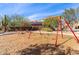 Playground featuring swings with mature landscaping surrounding at 3025 W Night Owl Ln, Phoenix, AZ 85085