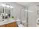 Bathroom featuring a modern vanity, and walk-in shower with sleek glass enclosure at 316 W Tonopah Dr # 3, Phoenix, AZ 85027