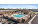 Inviting community pool area surrounded by lounge chairs and desert landscaping at 316 W Tonopah Dr # 3, Phoenix, AZ 85027