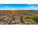 Sweeping aerial view captures the vibrant community, serene golf course, and picturesque mountain backdrop at 3400 E Isaiah Ave, Gilbert, AZ 85298