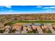 Stunning aerial view of a community featuring lush golf course, serene pond and beautiful single Gathering homes at 3400 E Isaiah Ave, Gilbert, AZ 85298