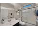 Well-lit bathroom with tiled shower/tub and modern vanity at 3400 E Isaiah Ave, Gilbert, AZ 85298