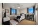 Bright bedroom featuring a ceiling fan and dual windows at 3400 E Isaiah Ave, Gilbert, AZ 85298