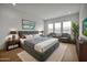 This bedroom features a large bed, a large window, and elegant decor at 34315 N Sandpiper Trl, Queen Creek, AZ 85144