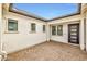 Cozy private outdoor patio with paved flooring and a view of the home's exterior windows and door at 34315 N Sandpiper Trl, Queen Creek, AZ 85144