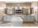 Luxurious bathroom featuring dual vanities, a soaking tub, and modern fixtures at 34801 N 53Rd St # 2, Cave Creek, AZ 85331