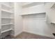 Walk-in closet with ample shelving and neutral carpet at 34801 N 53Rd St # 2, Cave Creek, AZ 85331