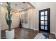 Elegant entryway featuring a decorative front door and a faux-stone accent wall at 34801 N 53Rd St # 2, Cave Creek, AZ 85331