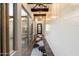 Bright hallway with shiplap walls, dark wood floors, and a view of the backyard at 34801 N 53Rd St # 2, Cave Creek, AZ 85331