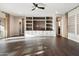 Spacious living room featuring a custom built-in entertainment center and wood flooring at 34801 N 53Rd St # 2, Cave Creek, AZ 85331