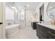 Elegant bathroom with a freestanding tub, walk-in shower, dual vanities, and stylish fixtures at 3538 E Glenrosa Ave, Phoenix, AZ 85018