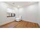 Minimalist bedroom with hardwood floors, a comfortable chair, and a window for natural light at 3538 E Glenrosa Ave, Phoenix, AZ 85018