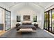 Comfortable bedroom featuring a king bed, two windows and sliding barn door at 3538 E Glenrosa Ave, Phoenix, AZ 85018