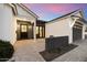 Elegant entrance with a paved courtyard, dark accents, and a modern design at 3538 E Glenrosa Ave, Phoenix, AZ 85018