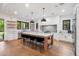 Modern kitchen with a large island, white cabinetry, and stainless steel appliances at 3538 E Glenrosa Ave, Phoenix, AZ 85018