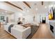 Expansive living room featuring hardwood floors, exposed beams, and an open layout at 3538 E Glenrosa Ave, Phoenix, AZ 85018