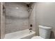 Bathroom featuring a tub and shower combination with gray textured wall tile at 3768 S Coach House Dr, Gilbert, AZ 85297