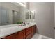 Bathroom featuring an extended vanity with double mirror and fresh green plant at 3768 S Coach House Dr, Gilbert, AZ 85297