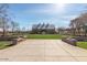 Wide shot of the rear entrance of the community clubhouse, framed by decorative brickwork and lush landscaping at 3768 S Coach House Dr, Gilbert, AZ 85297