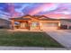 Charming single-story home featuring a well-manicured lawn and covered porch perfect for relaxing at 3768 S Coach House Dr, Gilbert, AZ 85297