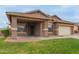 Inviting single-story home with a covered porch and lush green lawn, perfect for families at 3768 S Coach House Dr, Gilbert, AZ 85297