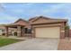 Charming single-story home with a two-car garage, covered entrance, and desert landscaping at 3768 S Coach House Dr, Gilbert, AZ 85297