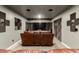 Home theater room with leather seating, TV, and soundproofing at 3768 S Coach House Dr, Gilbert, AZ 85297