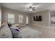 Inviting living room featuring neutral walls, tile floors, and an entertainment center at 3768 S Coach House Dr, Gilbert, AZ 85297