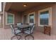 View of the covered patio with table, chairs, and brick flooring at 3768 S Coach House Dr, Gilbert, AZ 85297