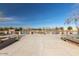 Scenic view of the pond, framed by decorative brickwork and lush landscaping, offering a serene community space at 3768 S Coach House Dr, Gilbert, AZ 85297