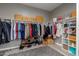 A well-organized walk-in closet with ample hanging space, shelving, and storage for clothes and accessories at 3768 S Coach House Dr, Gilbert, AZ 85297