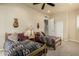 Cozy bedroom featuring twin beds, Southwestern decor, neutral paint, ceiling fan and carpet flooring at 3800 S Cantabria Cir # 1013, Chandler, AZ 85248