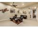 A bonus room showcasing two recliners and ottomans, complemented by a ceiling fan and decorative wall art at 3800 S Cantabria Cir # 1013, Chandler, AZ 85248