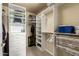 Walk in closet featuring built-in storage shelving for ample clothing and accessory organization at 3800 S Cantabria Cir # 1013, Chandler, AZ 85248