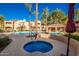 Relaxing community pool area with a rejuvenating hot tub, perfect for socializing and unwinding at 3800 S Cantabria Cir # 1013, Chandler, AZ 85248