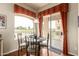 A dining area with a view of the golf course through the sliding glass door at 3800 S Cantabria Cir # 1013, Chandler, AZ 85248