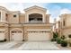 A two-story home featuring a multi-car garage and a small balcony over the garage at 3800 S Cantabria Cir # 1013, Chandler, AZ 85248