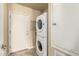 Convenient laundry area with stacked washer/dryer units and tile flooring at 3800 S Cantabria Cir # 1013, Chandler, AZ 85248