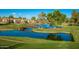 Scenic water view overlooking manicured landscaping and charming lakeside homes in a serene neighborhood at 3800 S Cantabria Cir # 1013, Chandler, AZ 85248