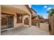 A covered back patio with an outdoor grill and a fully fenced yard at 3872 E Flower St, Gilbert, AZ 85298